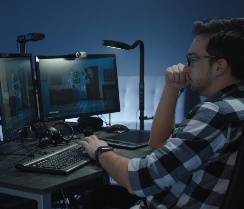 man working on his desktop doing animated film