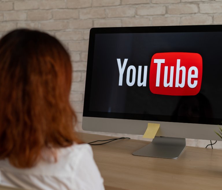 a desktop showing the youtube logo on the screen